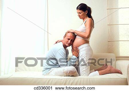 affection, belly, barefoot, at-home, 30's View Large Photo Image Stock Image - affection, belly, barefoot, at-home, 30's. Fotosearch