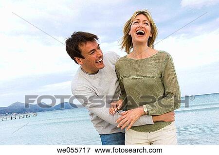 Stock Photo - affection, bond, beach, amusement, 30's. Fotosearch