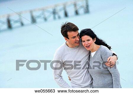 Stock Image - affection, bond, beach, autumn, 30's. Fotosearch