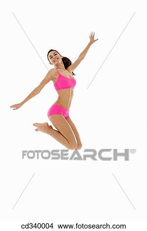 Picture - agile, brunette, Arms open, agility, action. Fotosearch