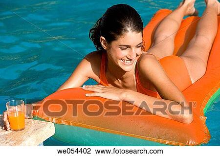 air mattress, brunette, bathing-suit, air-bed, adolescence View Large Photo Image Stock Image - air mattress, brunette, bathing-suit, air-bed, adolescence. Fotosearch