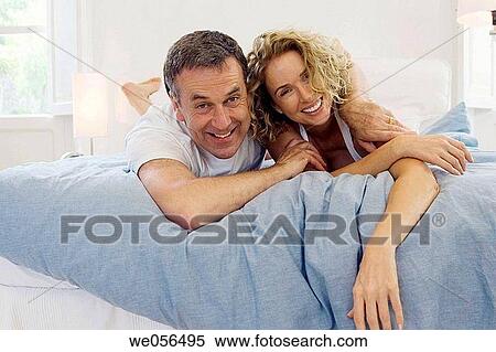 amusement, bed, baby boomer, at-home, affection View Large Photo Image Stock Photography - amusement, bed, baby boomer, at-home, affection. Fotosearch