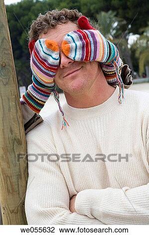 Stock Image - anonymous, arms folded, Arms crossed, amusement. Fotosearch