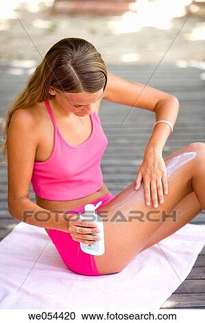Stock Image - apply, Body care, blond, adolescence. Fotosearch