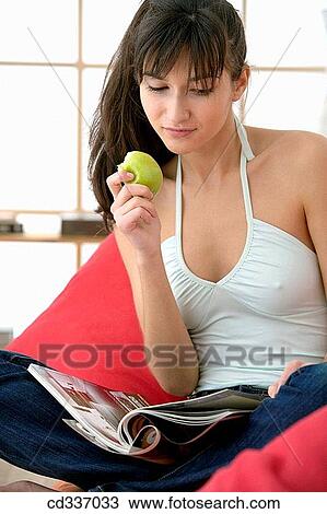 armchair, browsing, browse, at-home, apple View Large Photo Image Stock Image - armchair, browsing, browse, at-home, apple. Fotosearch