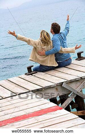 Arms raised, bonding, bond, back view, Arms open View Large Photo Image Stock Photography - Arms raised, bonding, bond, back view, Arms open. Fotosearch