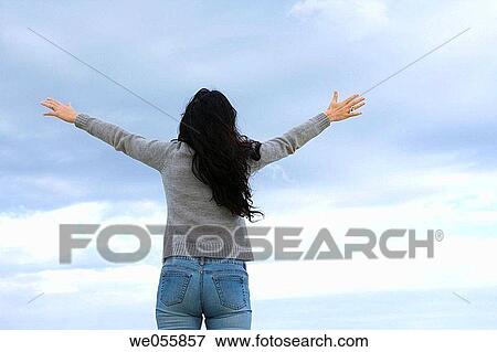 Arms raised, brunette, back view, Arms open View Large Photo Image Stock Photo - Arms raised, brunette, back view, Arms open. Fotosearch