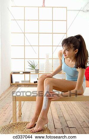 Picture - at-home, Body care, barefoot, apply. Fotosearch