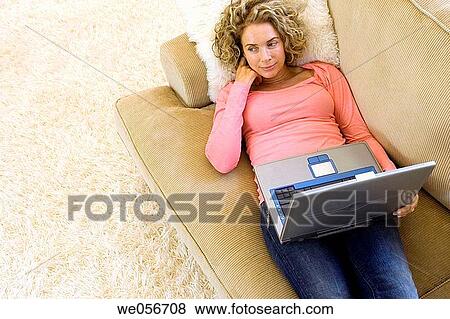 Stock Photo - at-home, calm, baby boomer, absorbed. Fotosearch