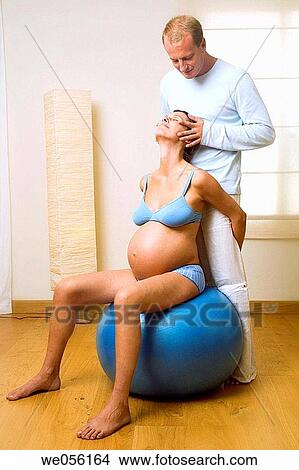 Picture - at-home, caress, barefoot, ball, 30's. Fotosearch