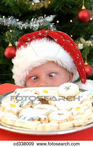 Stock Photo - at-home, Christmas, child, boy, amusing. Fotosearch