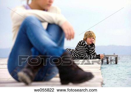 Stock Image - autumn, calm, boy, blond, absorbed. Fotosearch
