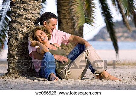 Stock Photograph - baby boomer, barefoot, beach, bond, bonding. Fotosearch