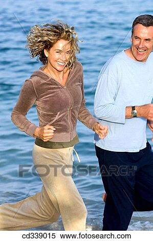 Stock Photography - baby boomer, beach, barefoot, activity. Fotosearch