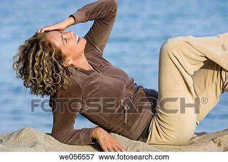 Stock Photo - baby boomer, beach, break, break-time, carefree. Fotosearch
