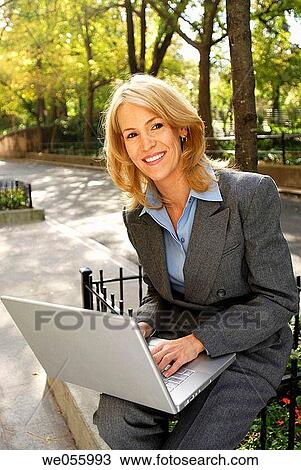 Stock Image - baby boomer, blond, business, businesspeople, businesswoman. Fotosearch