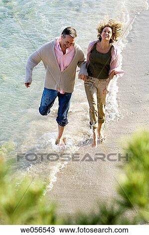 Stock Image - baby boomer, bond, beach, barefoot, amusement. Fotosearch
