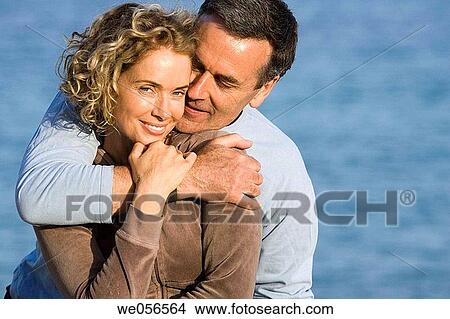 Picture - baby boomer, bonding, bond, beach, affection. Fotosearch