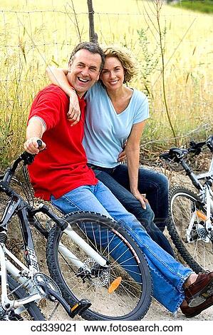 Stock Image - baby boomer, bonding, bond, bicycle, affection. Fotosearch