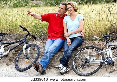 Stock Photograph - baby boomer, bonding, bond, bicycle, affection. Fotosearch