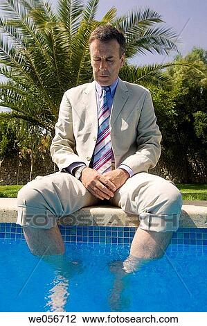 Stock Image - baby boomer, business, border, barefoot, absorbed. Fotosearch