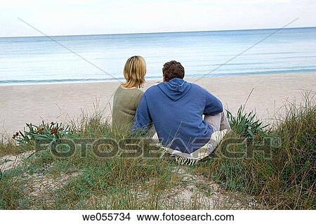 Picture - back view, beach, calm. Fotosearch