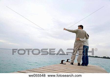 Stock Photo - back view, bond, bonding, calm, cloudy. Fotosearch
