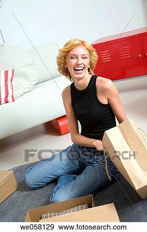 Stock Photo - bag, blue eyes, blond, at-home. Fotosearch