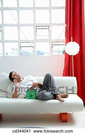 Stock Image - bag, calling, barefoot, at-home. Fotosearch