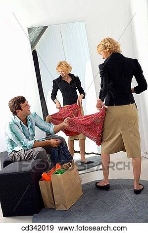 Stock Photo - bag, changing-room, choice, choosing. Fotosearch