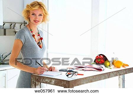 Stock Image - Ball-point pen, calculator, at-home. Fotosearch
