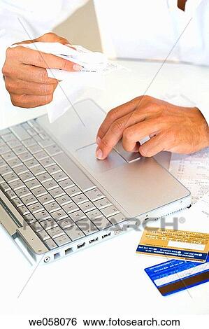 Bank card, bill, calculate, calculating, calculation View Large Photo Image Stock Photograph - Bank card, bill, calculate, calculating, calculation. Fotosearch
