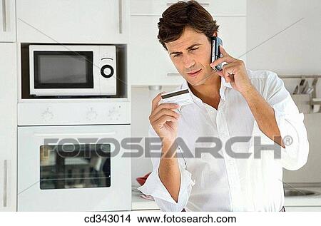 Bank card, calling, buying, buy, at-home View Large Photo Image Picture - Bank card, calling, buying, buy, at-home. Fotosearch