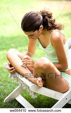 barefoot, brunette, Body care, adolescence View Large Photo Image Stock Image - barefoot, brunette, Body care, adolescence. Fotosearch