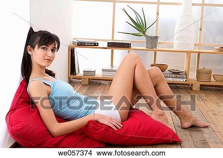Picture - barefoot, calm, brunette, at-home. Fotosearch