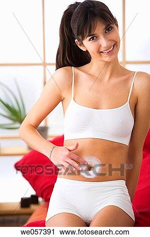 belly, brunette, Body care, apply View Large Photo Image Stock Image - belly, brunette, Body care, apply. Fotosearch