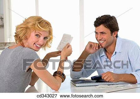 Stock Photo - bill, calculator, at-home. Fotosearch