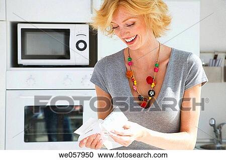 Stock Image - bill, checking, check, at-home. Fotosearch