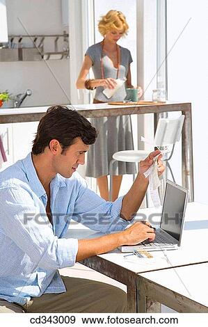 Stock Photo - bill, checking, check, at-home. Fotosearch