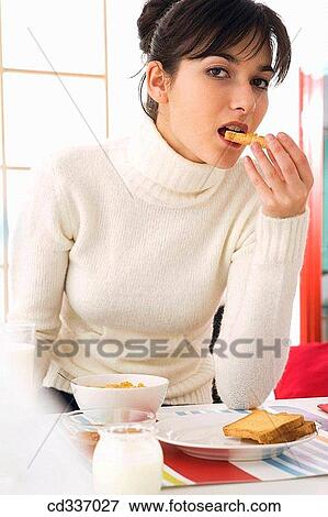 bite, biting, bowl, breakfast, brunette View Large Photo Image Stock Photo - bite, biting, bowl, breakfast, brunette. Fotosearch
