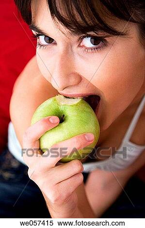 bite, brunette, biting, apple View Large Photo Image Stock Photography - bite, brunette, biting, apple. Fotosearch