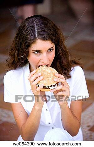 bite, burger, brunette, biting, adolescence View Large Photo Image Stock Image - bite, burger, brunette, biting, adolescence. Fotosearch