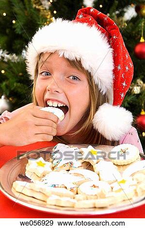bite, celebration, celebrate, biting, at-home View Large Photo Image Stock Photo - bite, celebration, celebrate, biting, at-home. Fotosearch