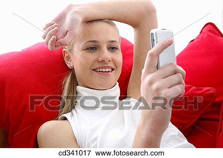 Stock Photo - blond, cell phone, calling, appointment. Fotosearch