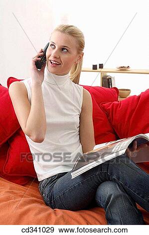 Stock Photo - blond, chat, at-home. Fotosearch