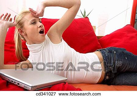 Stock Photo - blond, chilling out, at-home. Fotosearch