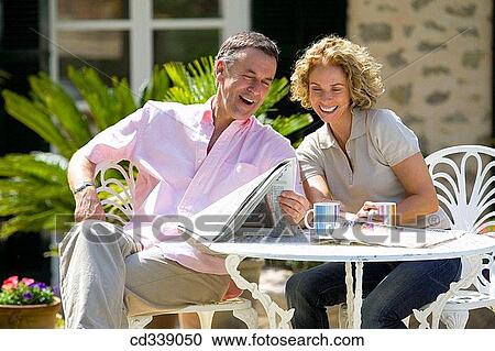 Stock Image - blond, coffee, breakfast, at-home. Fotosearch