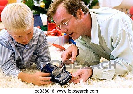 boy, Christmas, child, at-home View Large Photo Image Stock Photograph - boy, Christmas, child, at-home. Fotosearch