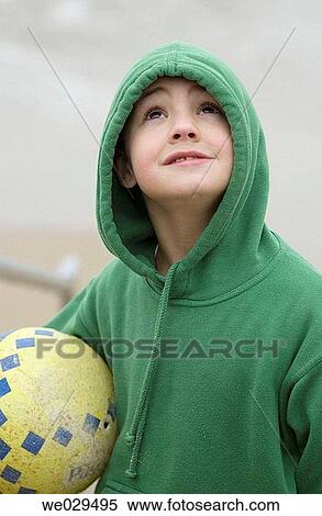 Boy holding a ball at beach. Hendaye. Aquitaine, France View Large Photo Image Stock Photography - Boy holding a ball at beach. Hendaye. Aquitaine, France. Fotosearch