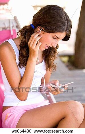 brunette, cell phone, adolescence View Large Photo Image Stock Image - brunette, cell phone, adolescence. Fotosearch